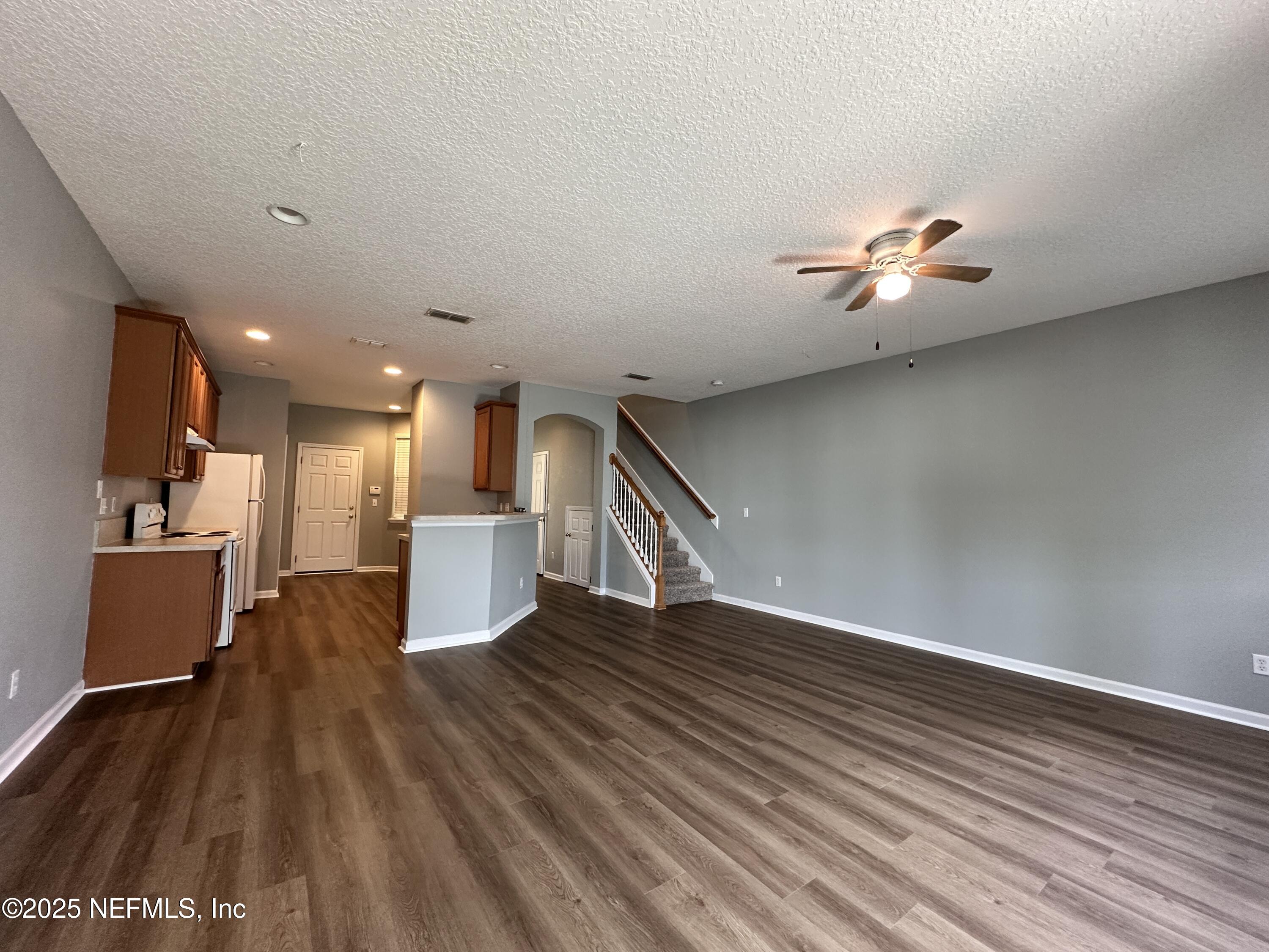 3730 Creswick Circle, Unit 5 Orange Park, FL 32065 - Photo 5 of 18 a view of an empty room with wooden floor and a window