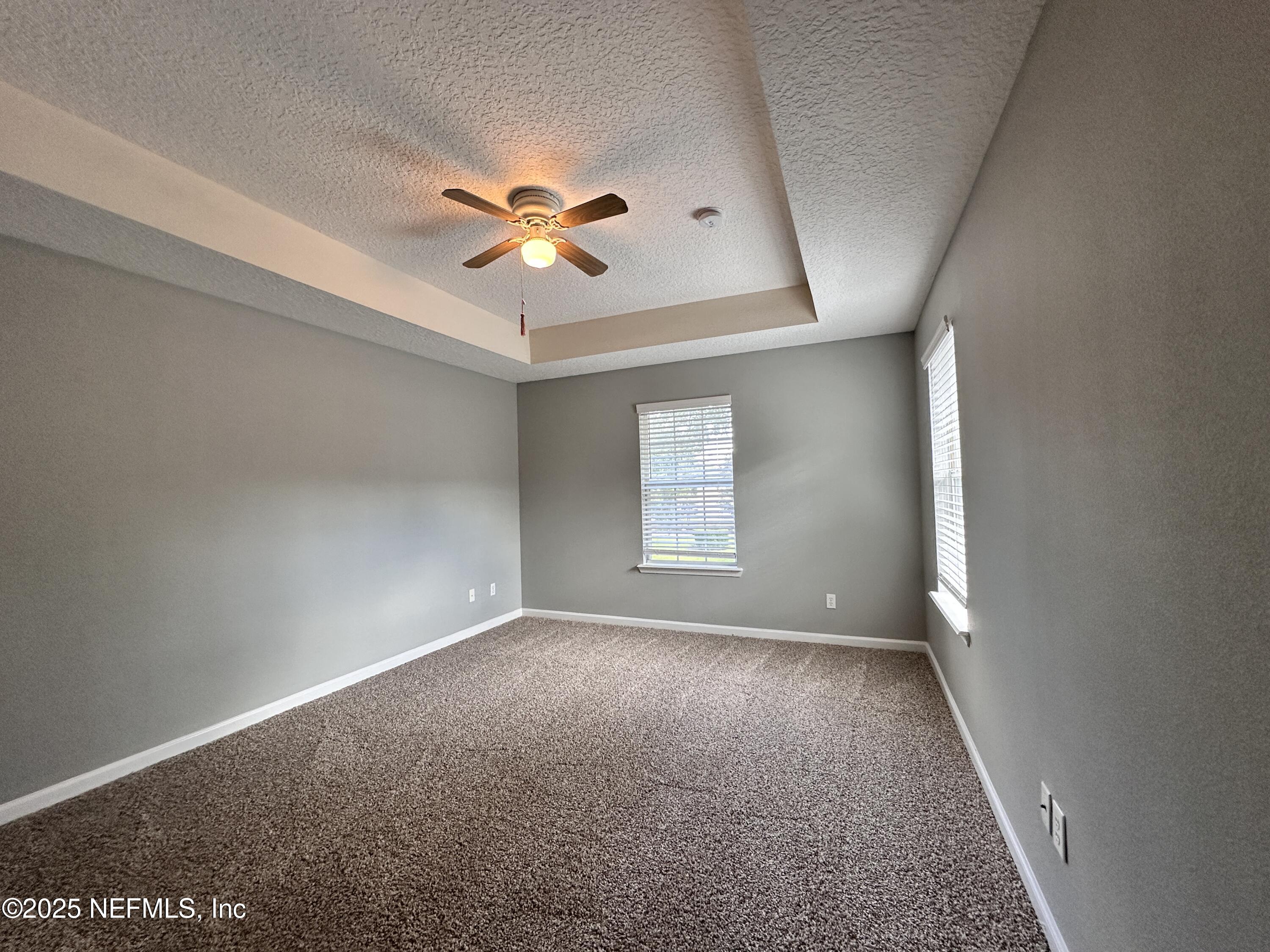 3730 Creswick Circle, Unit 5 Orange Park, FL 32065 - Photo 9 of 18 a view of room with a ceiling fan and window