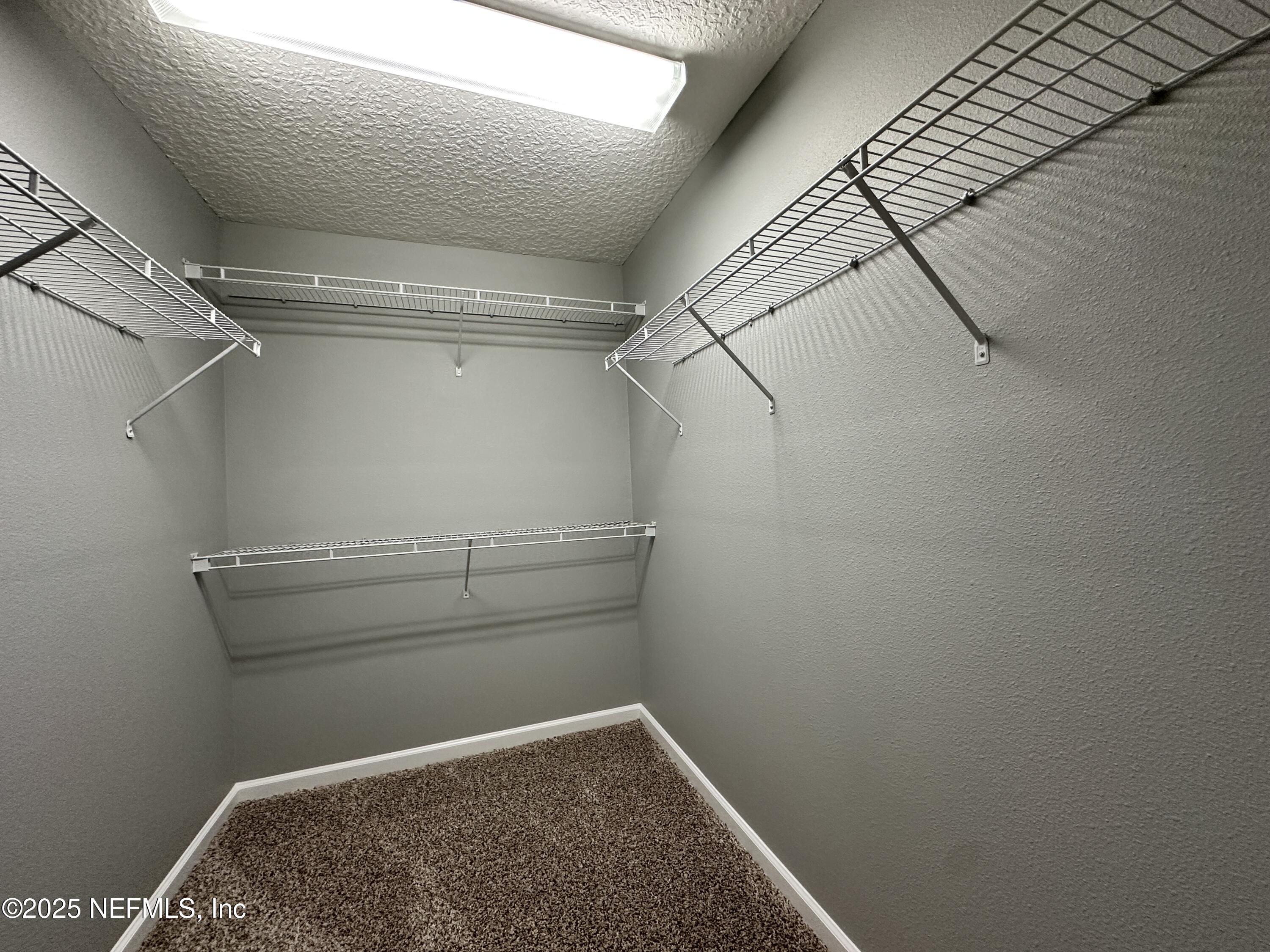 3730 Creswick Circle, Unit 5 Orange Park, FL 32065 - Photo 10 of 18 a view of a room with racks on the wall