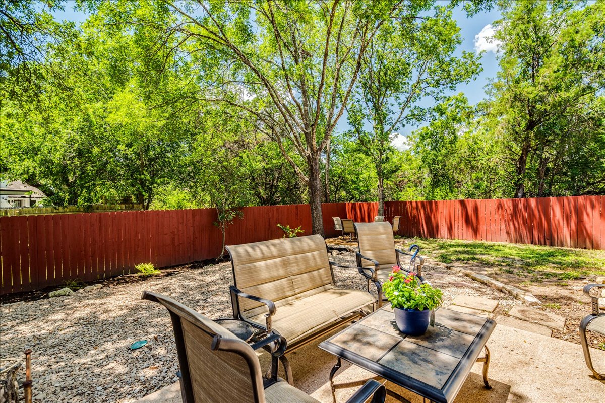 9300 Tea Rose Trail Austin, TX 78748 - Photo 29 of 33 An inviting backyard patio offers ample space for outdoor relaxation and entertaining.