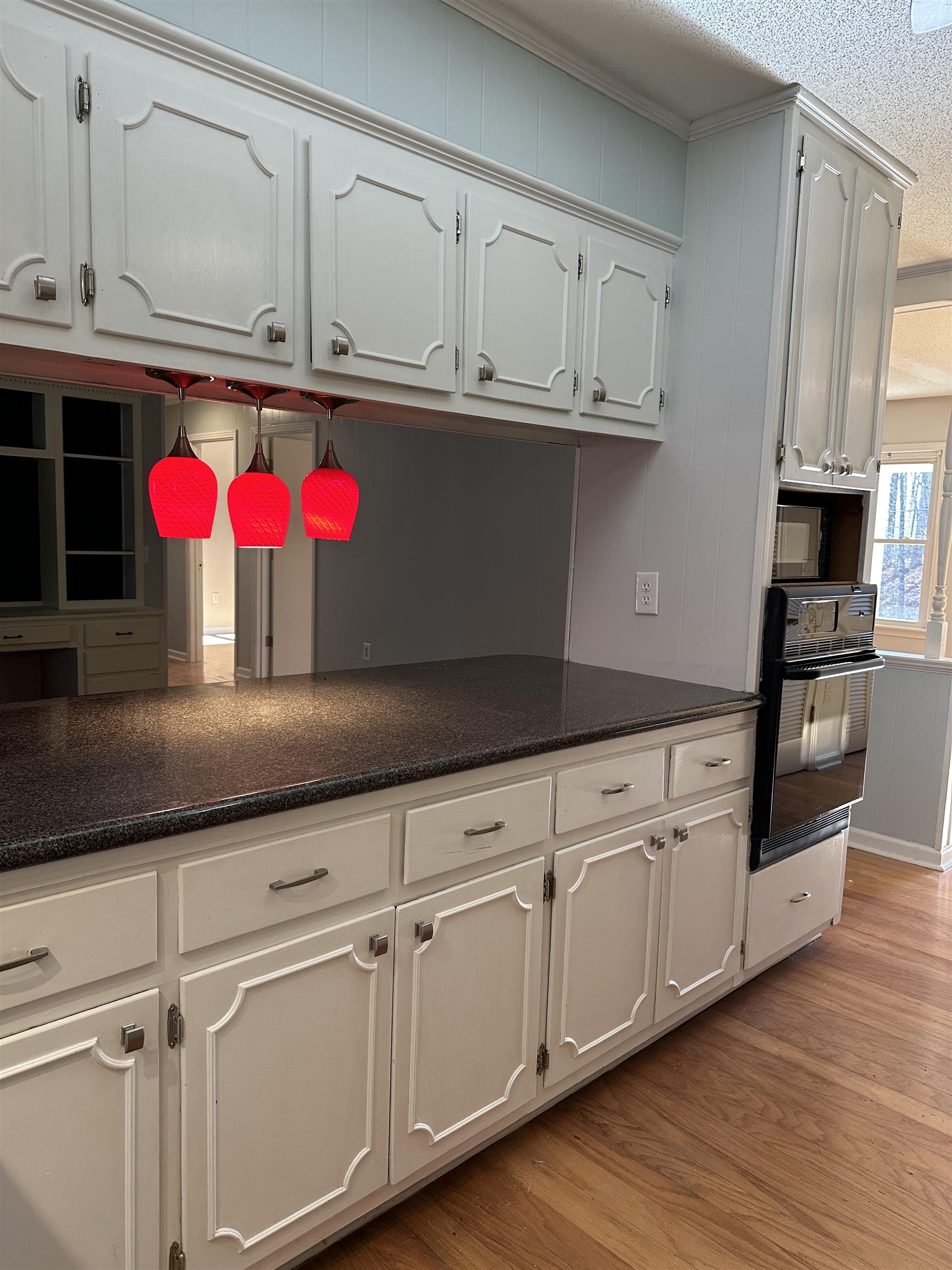 141 Pecan Street Selmer, TN 38375 - Photo 12 of 35 a kitchen with granite countertop stainless steel appliances sink and cabinets