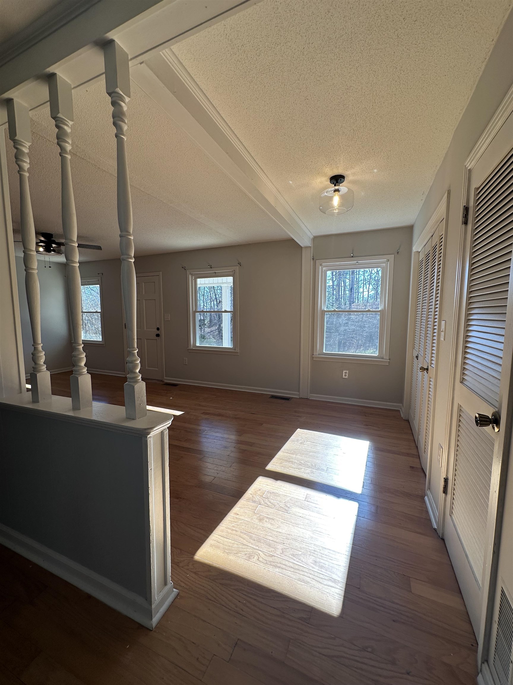 141 Pecan Street Selmer, TN 38375 - Photo 15 of 35 a living room with hardwood floor and a window