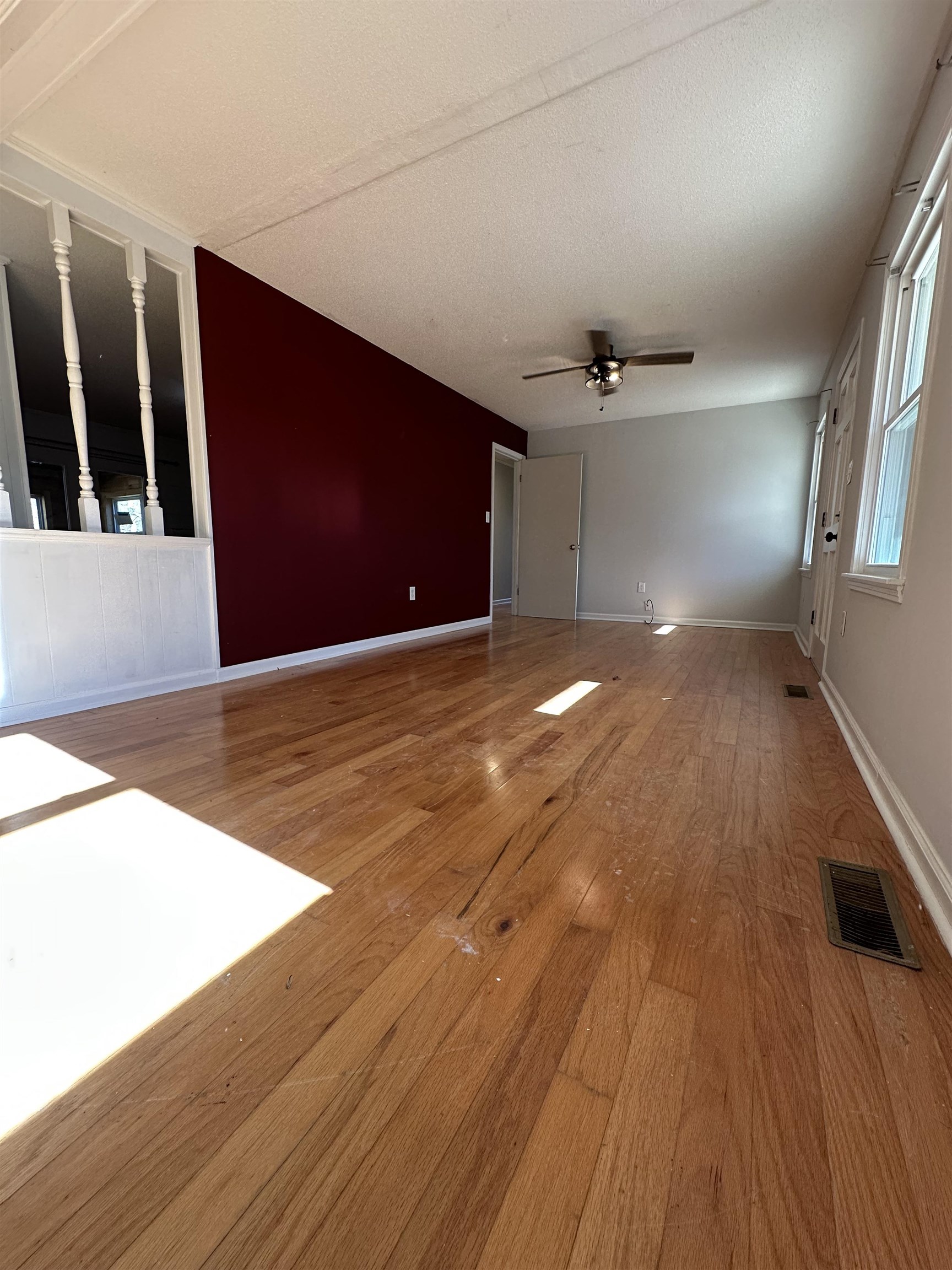 141 Pecan Street Selmer, TN 38375 - Photo 16 of 35 a view of an empty room with wooden floor