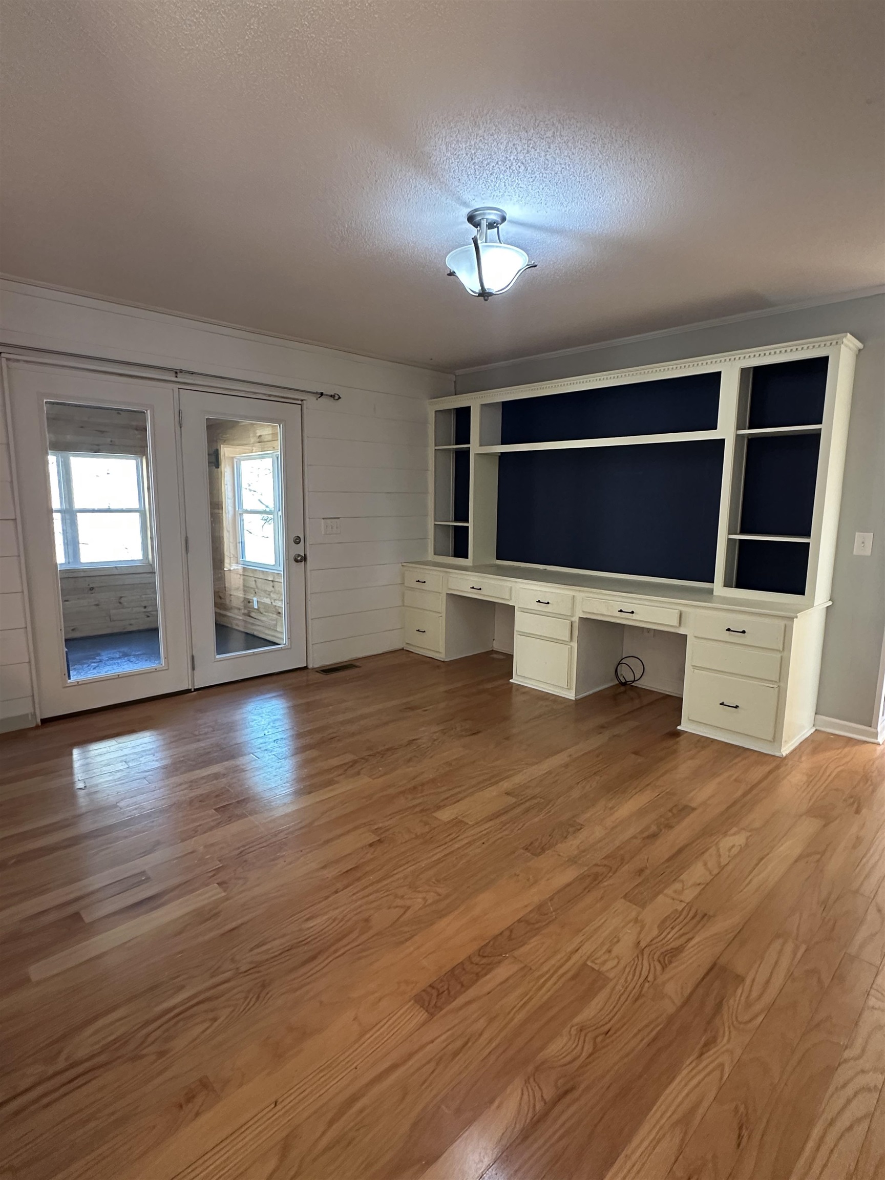 141 Pecan Street Selmer, TN 38375 - Photo 20 of 35 a view of an empty room with a fireplace and a window