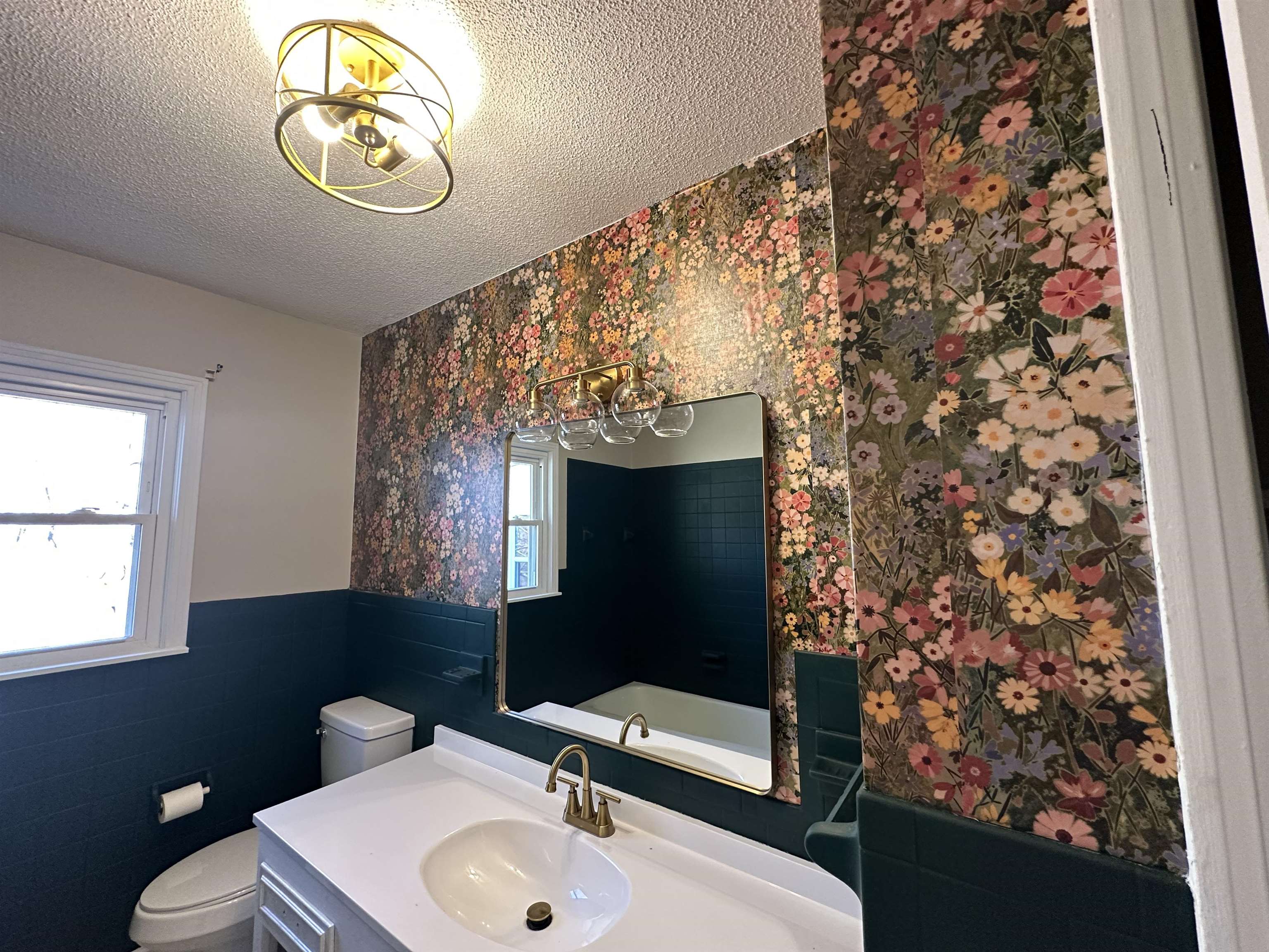141 Pecan Street Selmer, TN 38375 - Photo 25 of 35 a bathroom with a sink toilet and mirror