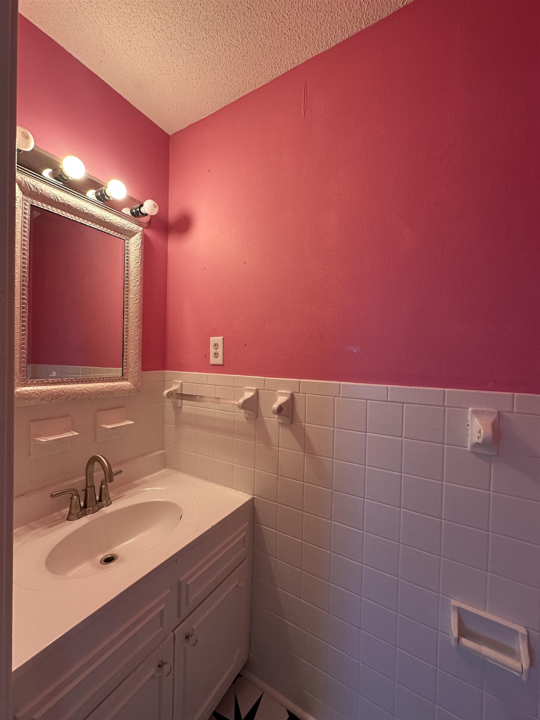 141 Pecan Street Selmer, TN 38375 - Photo 32 of 35 a bathroom with a sink shower and a mirror