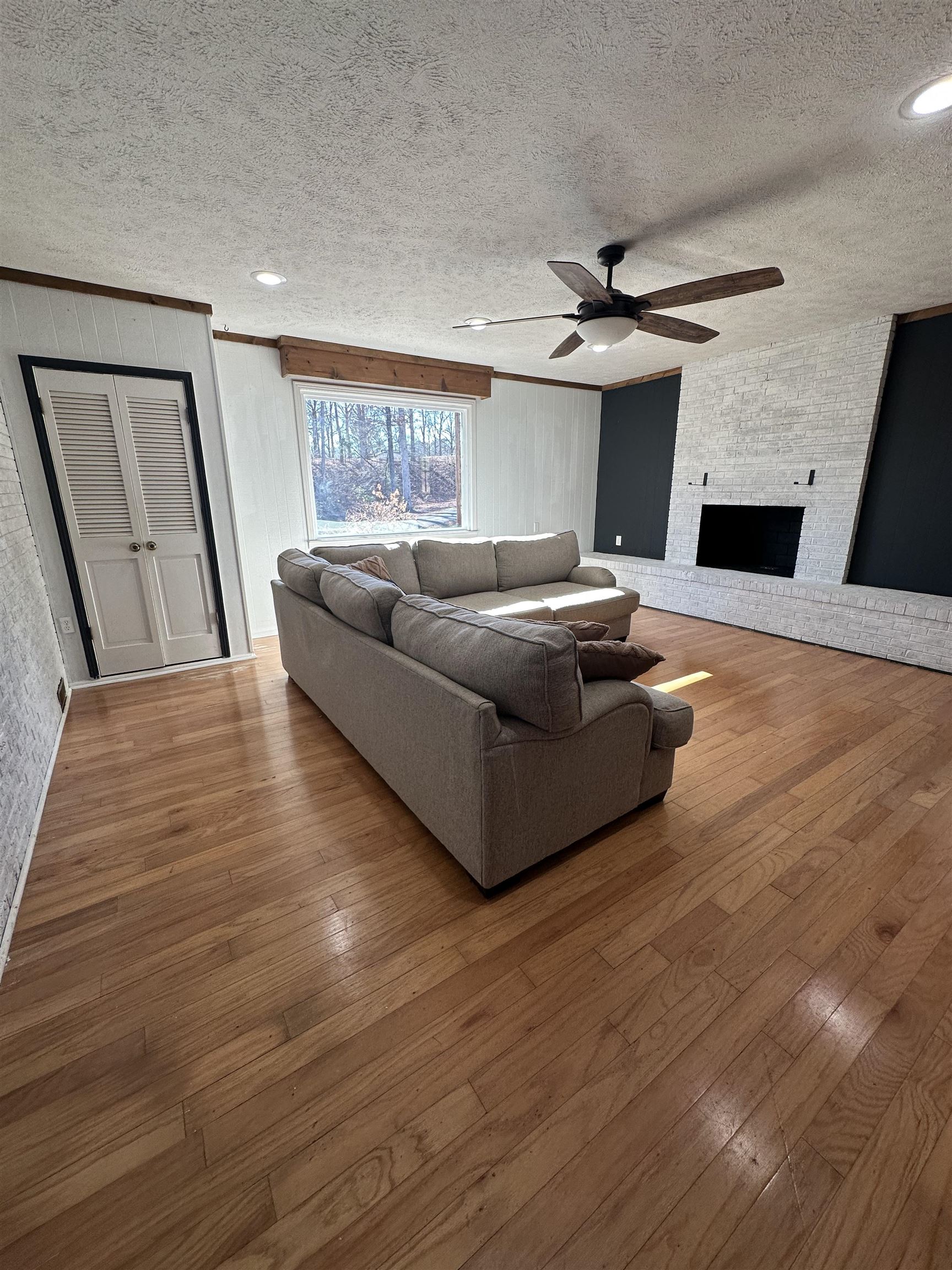 141 Pecan Street Selmer, TN 38375 - Photo 4 of 35 a living room with furniture and a fireplace