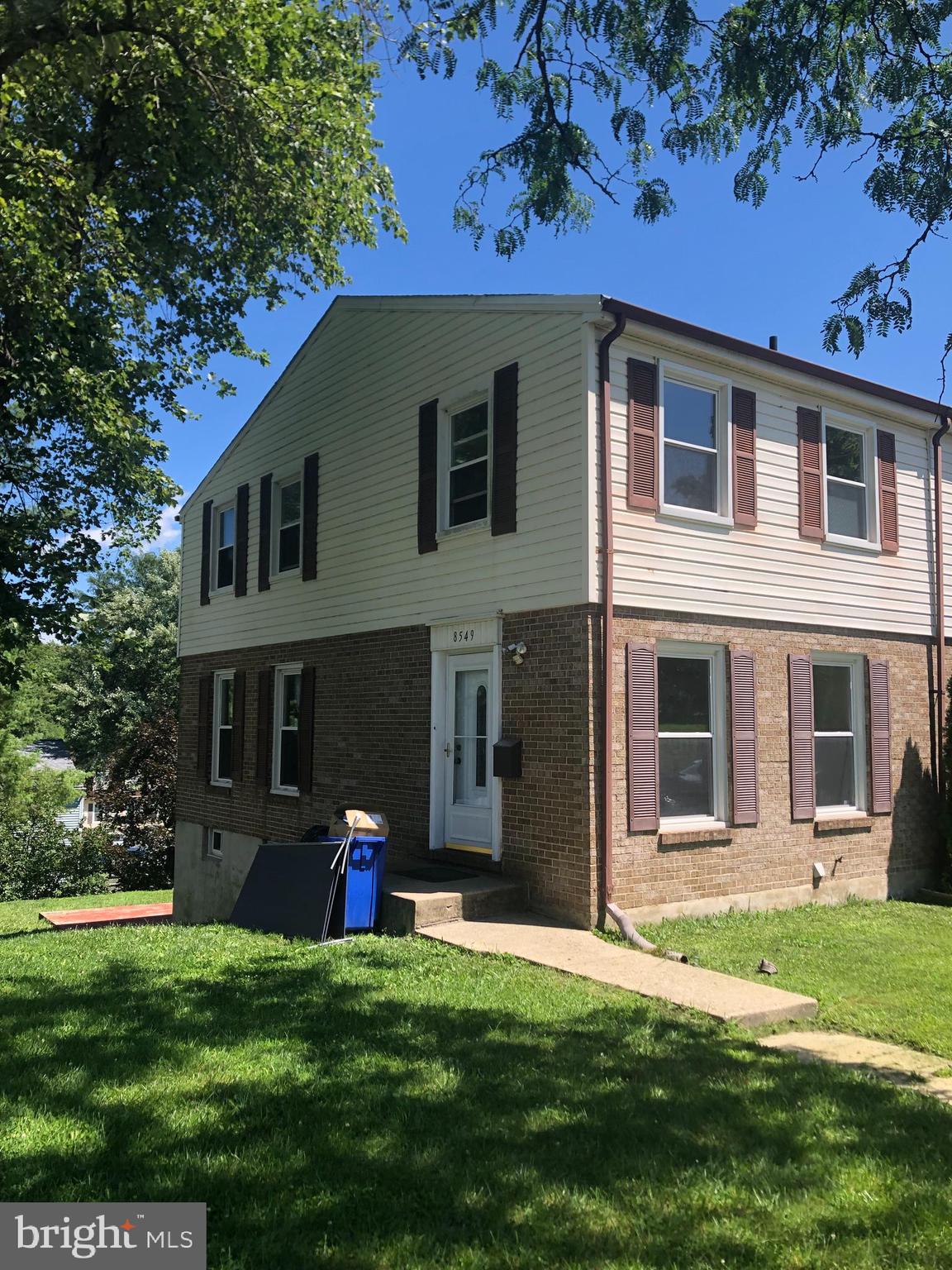 8549 Ramort Drive, Unit 23A Nottingham, MD 21236 - Photo 1 of 18 a front view of a house with a yard