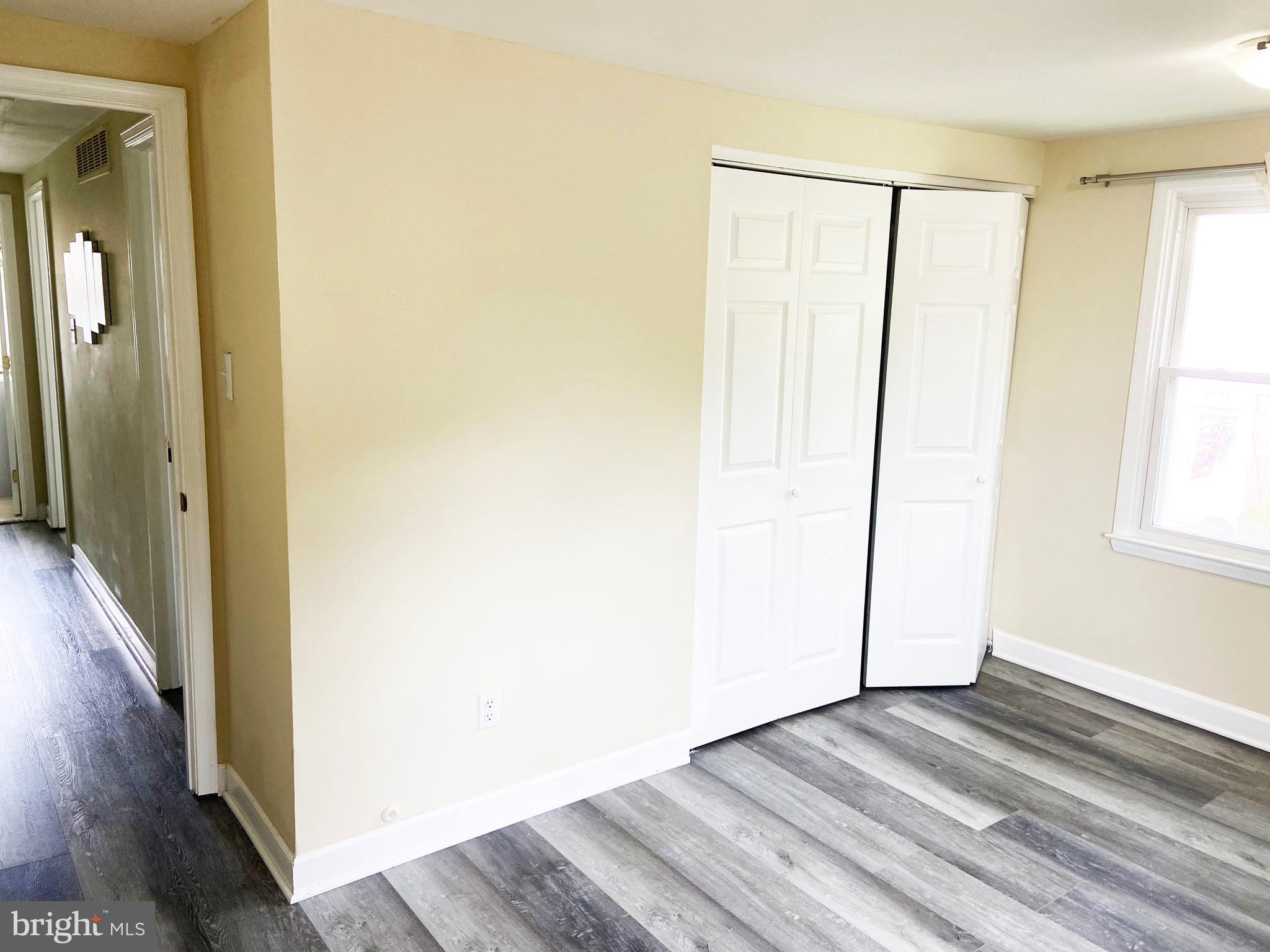8549 Ramort Drive, Unit 23A Nottingham, MD 21236 - Photo 13 of 18 a view of a room with wooden floor and a window