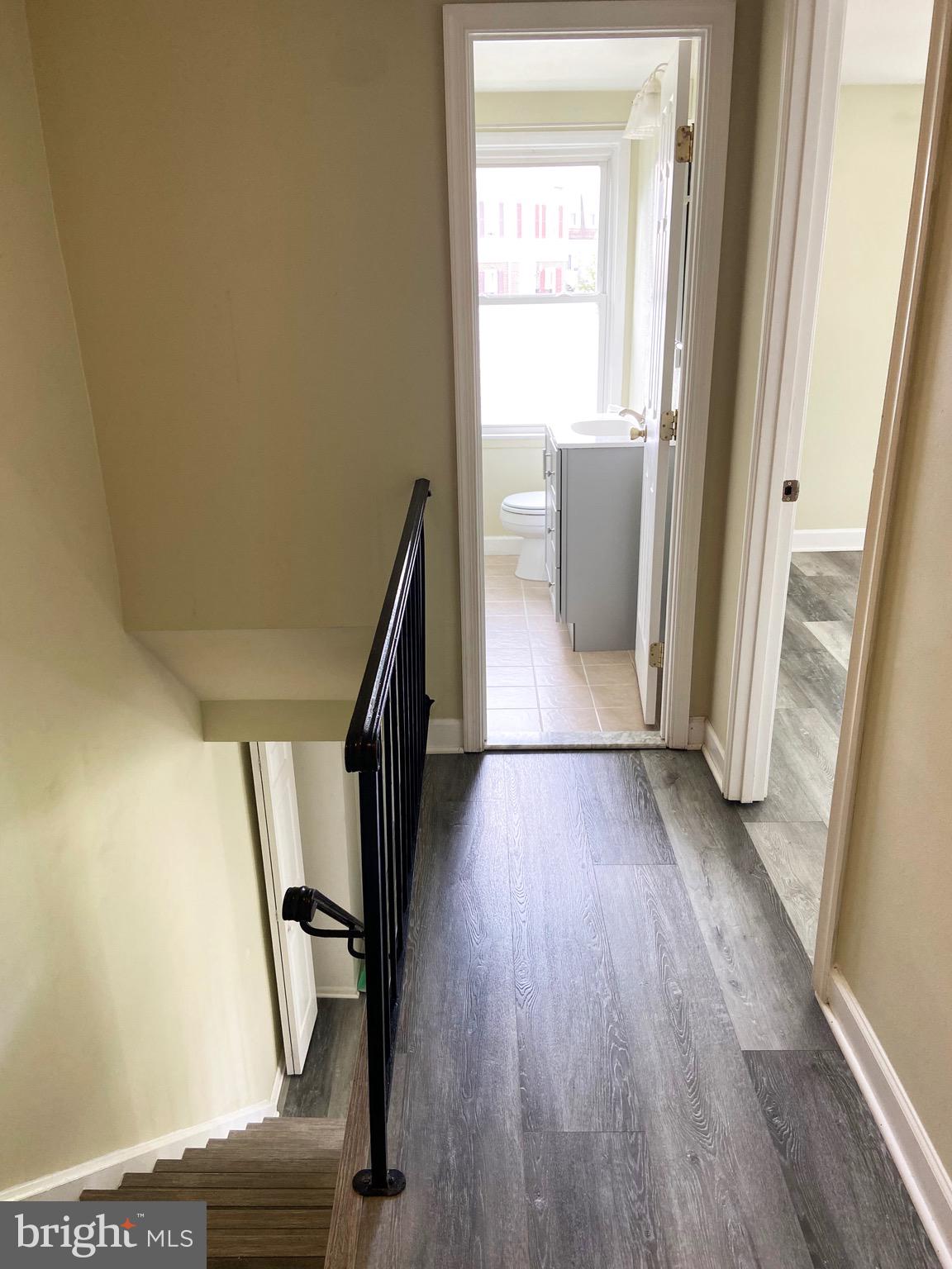 8549 Ramort Drive, Unit 23A Nottingham, MD 21236 - Photo 8 of 18 a view of entryway with wooden floor and stairs
