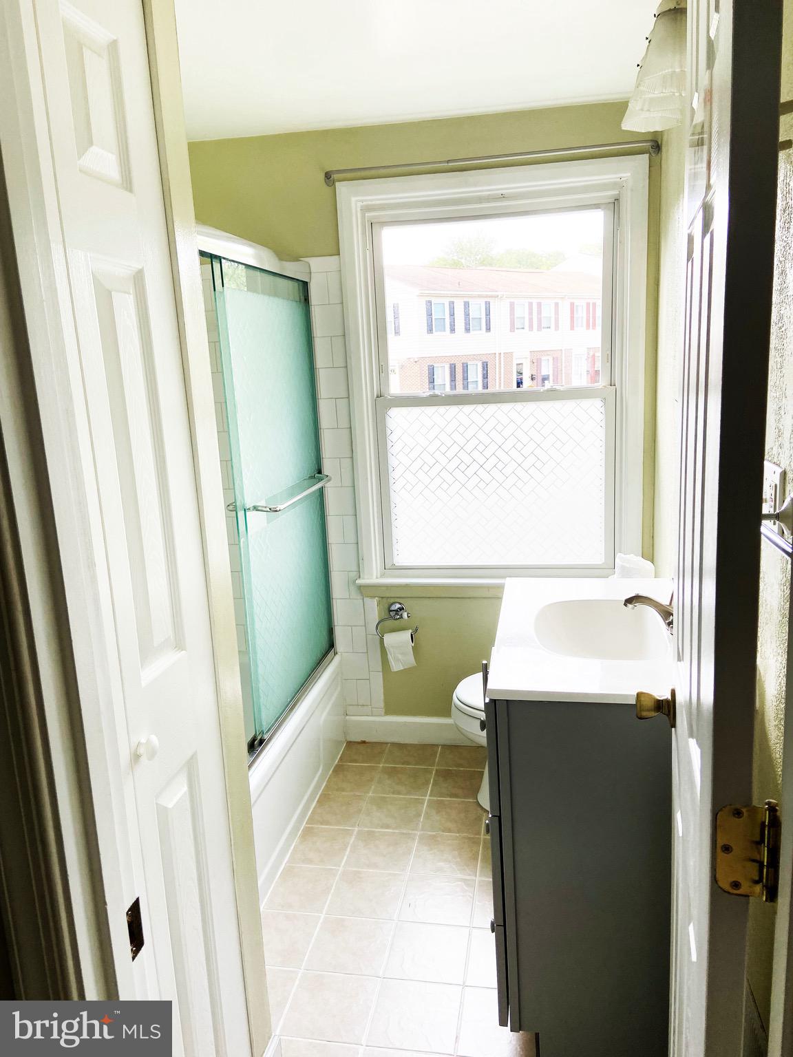 8549 Ramort Drive, Unit 23A Nottingham, MD 21236 - Photo 9 of 18 a bathroom with a sink toilet and shower