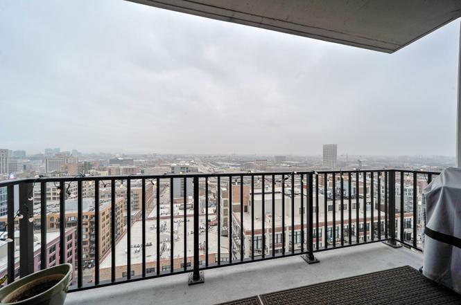 210 South Desplaines Street, Unit 2104 Chicago, IL 60661 - Photo 9 of 9 a balcony with wooden floor