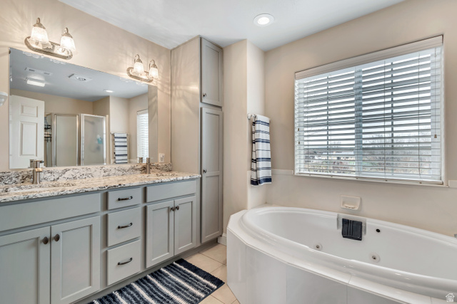 1697 North 500 West Mapleton, UT 84664 - Photo 25 of 50 Bathroom with double vanity, a stall shower, plenty of natural light, light tile patterned floors, and recessed lighting