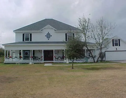 a front view of a building with swimming pool