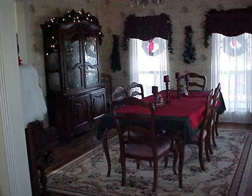 a view of a dining room with furniture and window