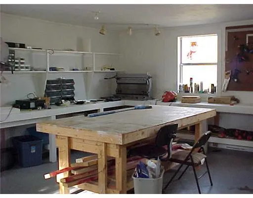 a room with gym equipment and window