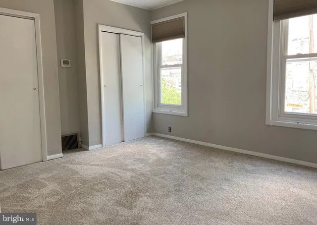 an empty room with windows