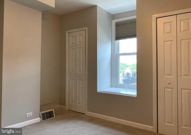 a view of an empty room and window