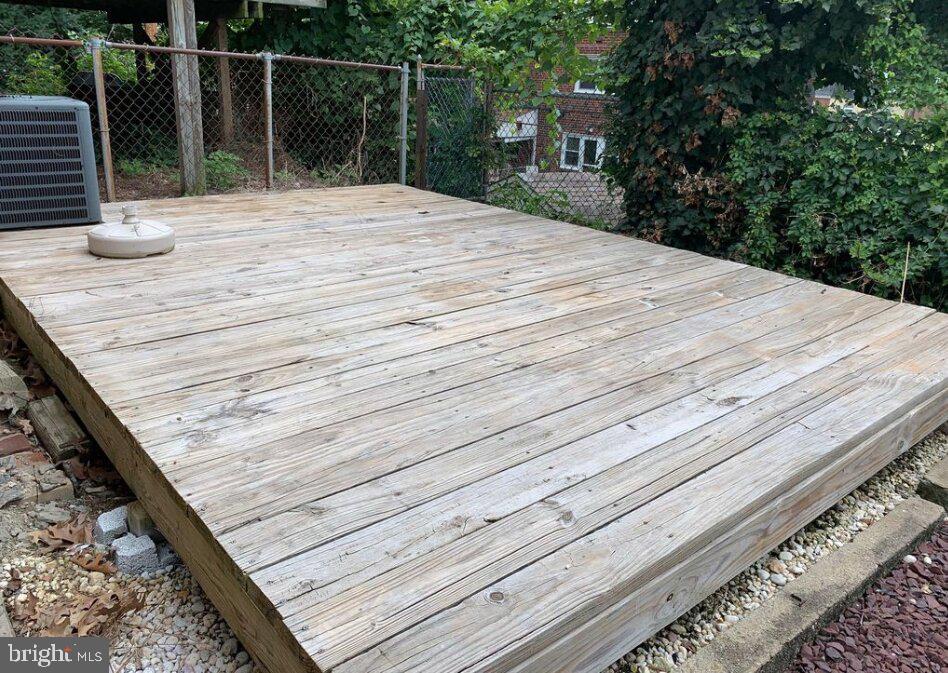 272 Kalos Street Philadelphia, PA 19128 - Photo 21 of 21 a bedroom with a bed and wooden deck