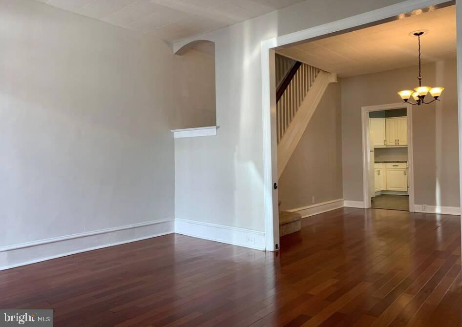 272 Kalos Street Philadelphia, PA 19128 - Photo 6 of 21 a view of a hallway with wooden floor and staircase