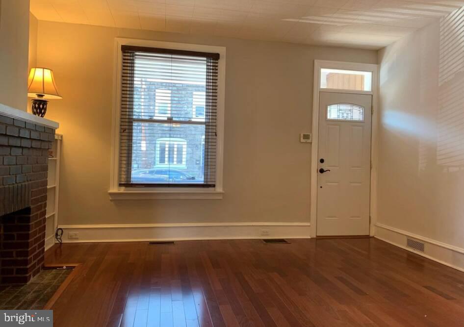 272 Kalos Street Philadelphia, PA 19128 - Photo 7 of 21 an empty room with wooden floor and windows