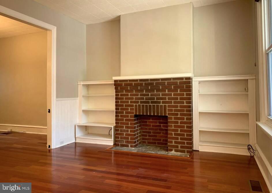 272 Kalos Street Philadelphia, PA 19128 - Photo 8 of 21 a view of an empty room with wooden floor and a window