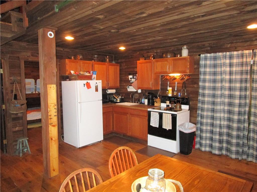 789 Bullion Road, Unit BULLION ROAD Polk, PA 16342 - Photo 4 of 19 a view of a kitchen with furniture and wooden floor