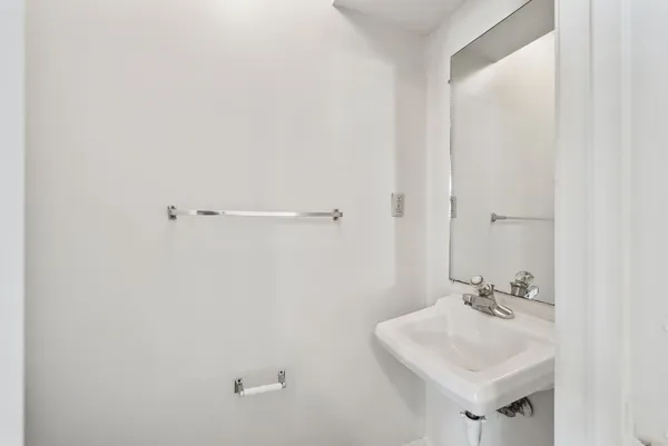 a bathroom with a sink a mirror and a shower