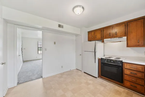 a kitchen with a sink and a stove
