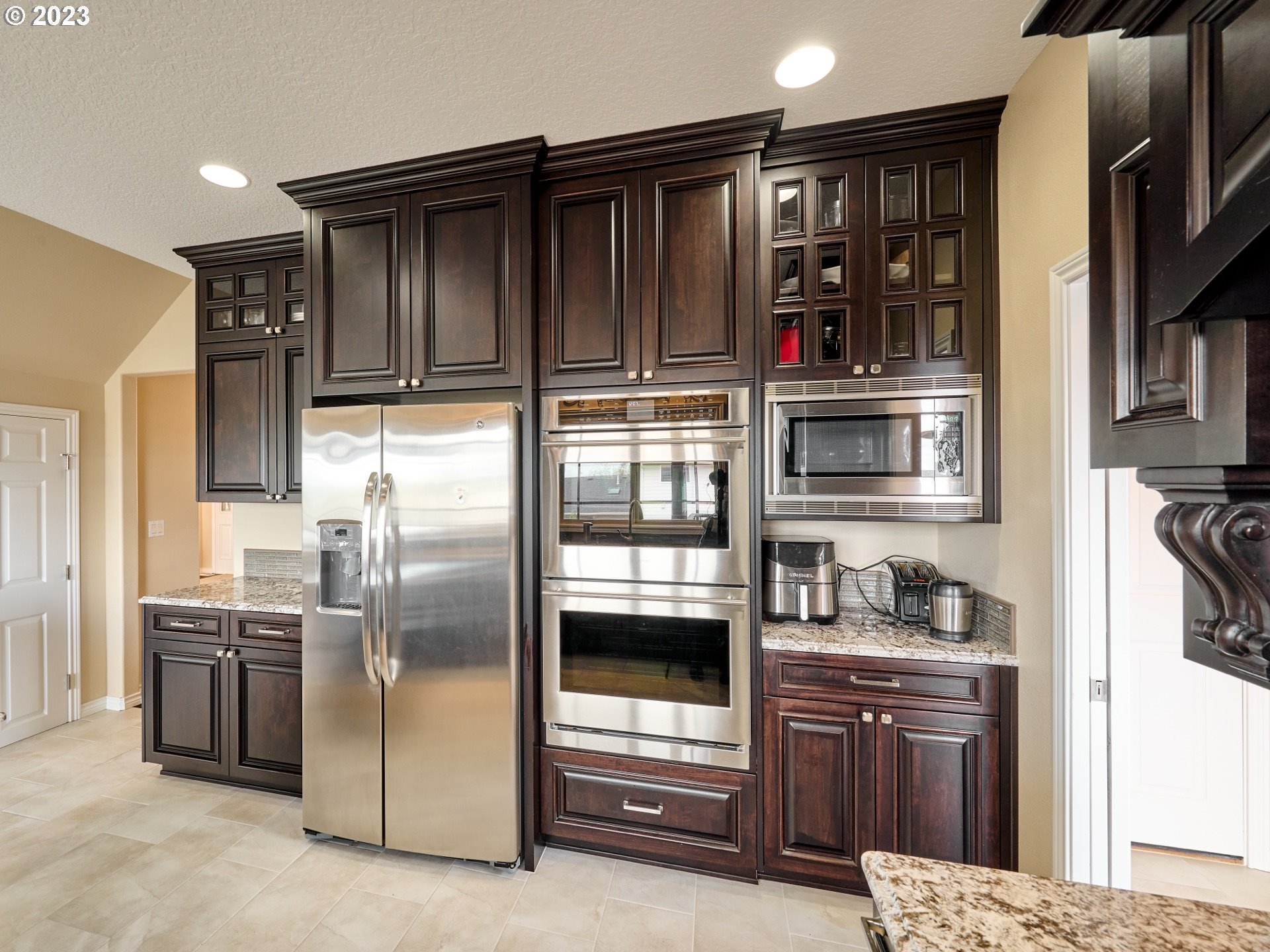 104 Breyonna Way Silverton, OR 97381 - Photo 18 of 45 a kitchen with stainless steel appliances granite countertop a refrigerator and a sink