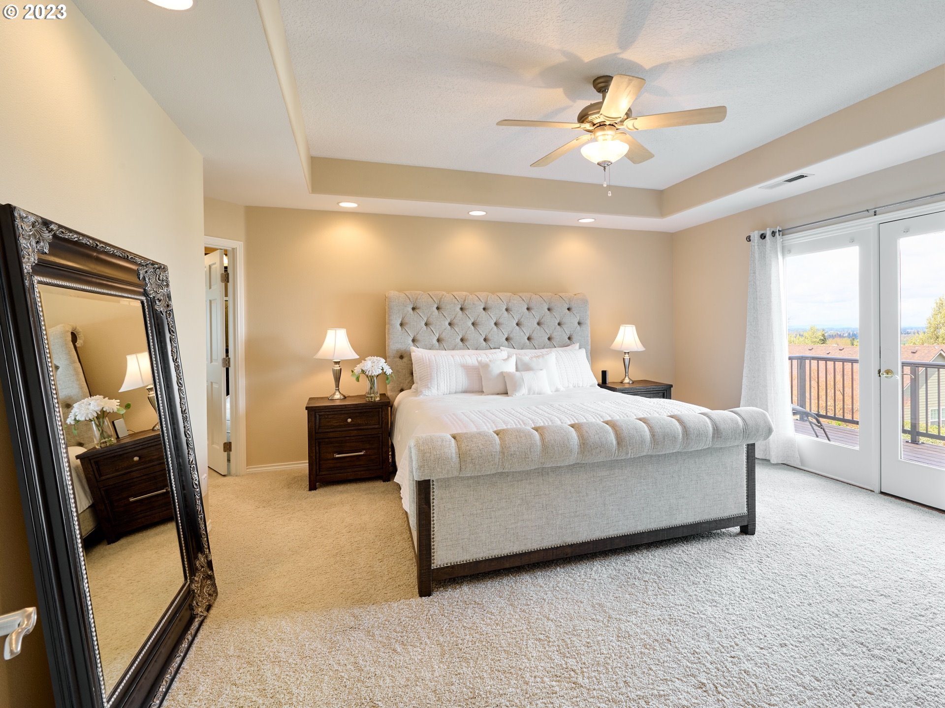 104 Breyonna Way Silverton, OR 97381 - Photo 20 of 45 a bedroom with a bed and a chandelier