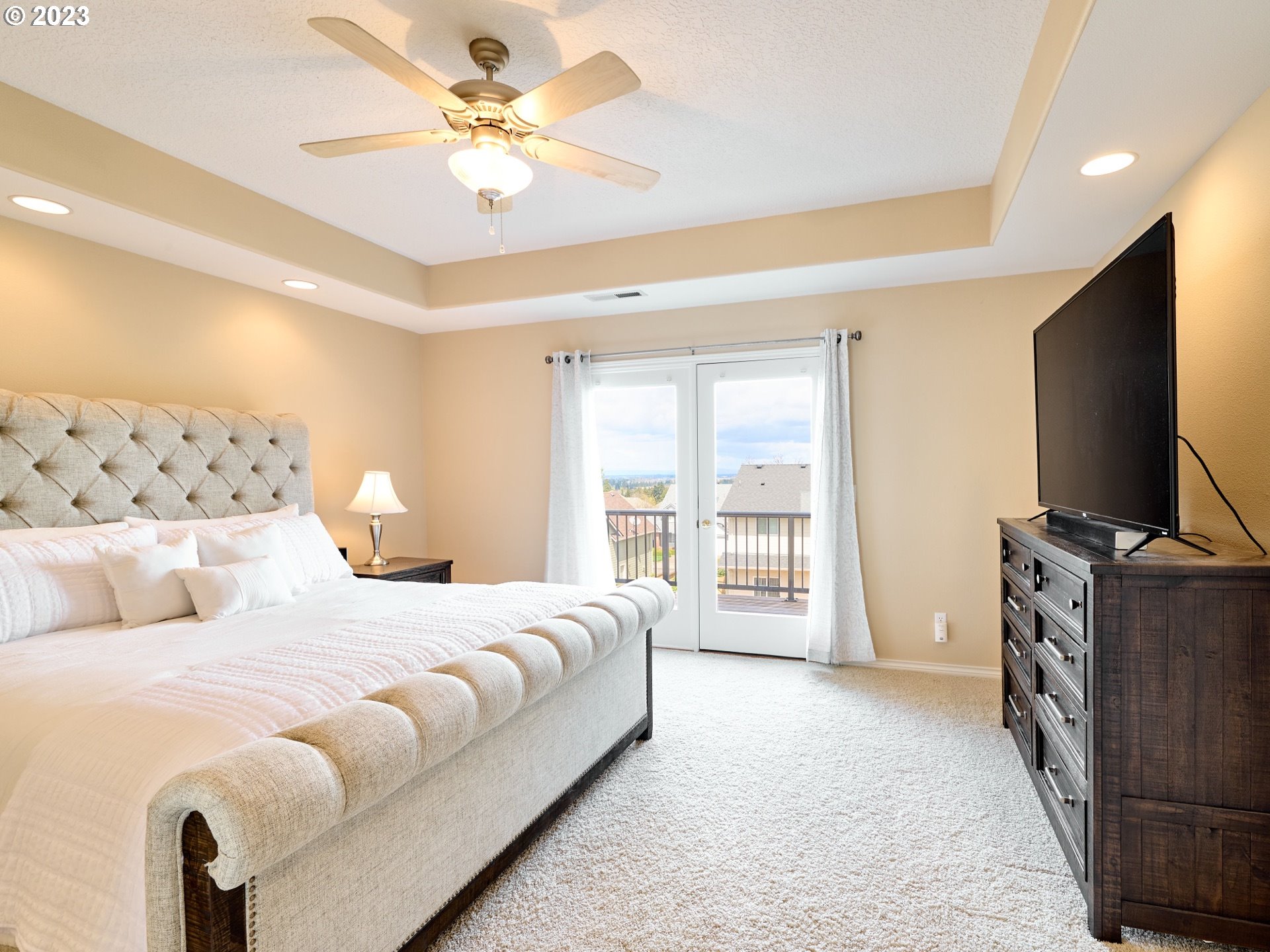 104 Breyonna Way Silverton, OR 97381 - Photo 21 of 45 a bedroom with a bed and a flat screen tv