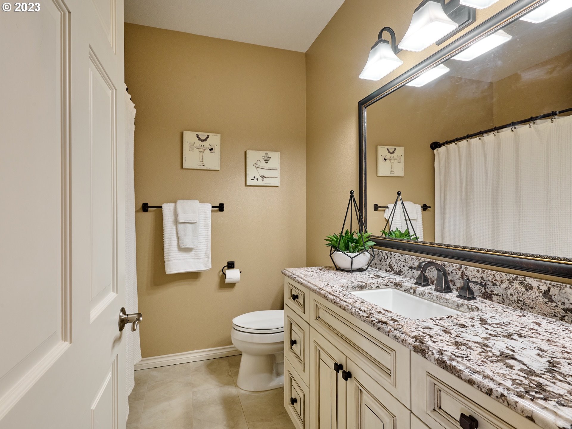 104 Breyonna Way Silverton, OR 97381 - Photo 26 of 45 a bathroom with a granite countertop toilet sink and mirror