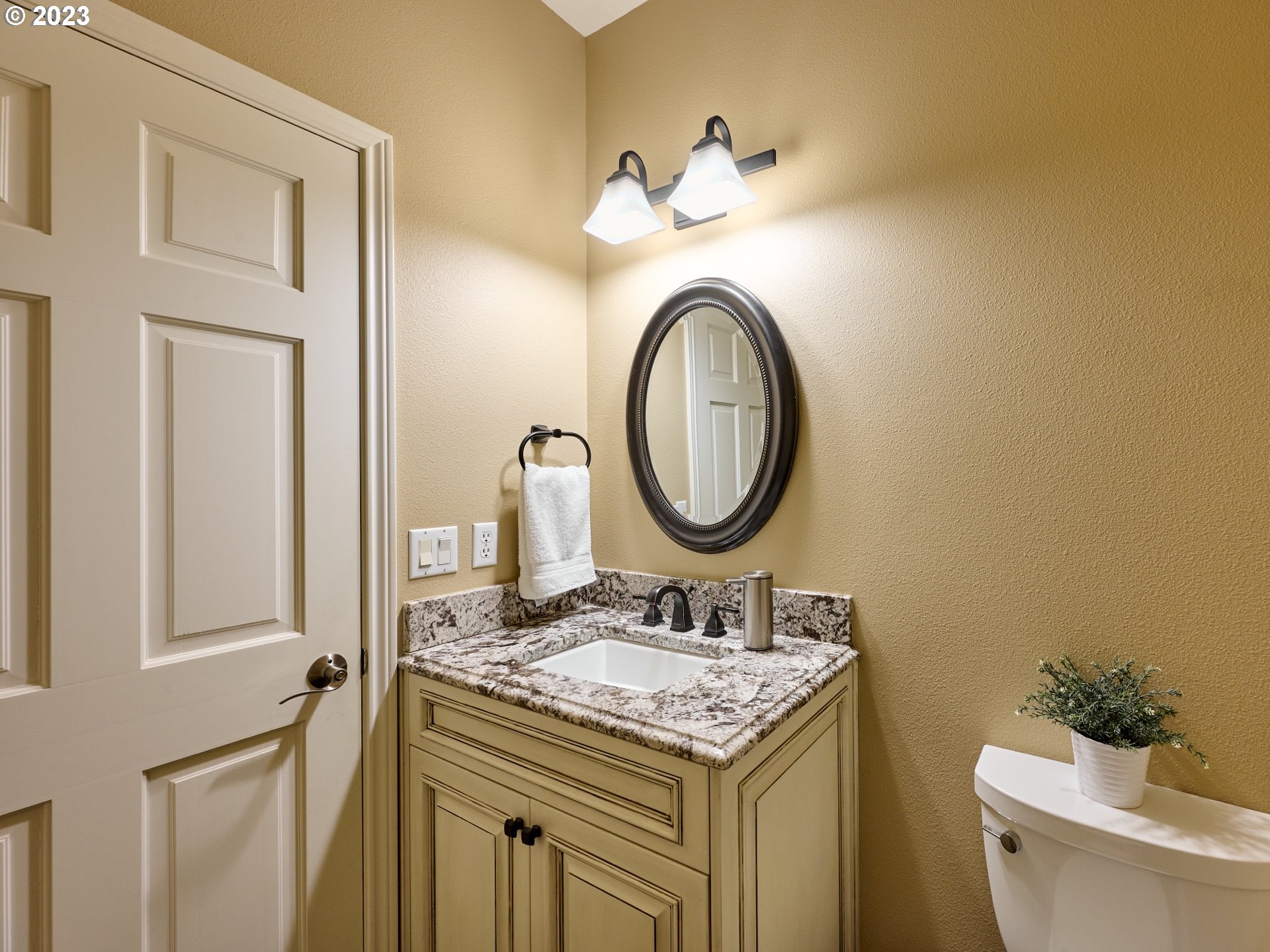 104 Breyonna Way Silverton, OR 97381 - Photo 30 of 45 a bathroom with a granite countertop sink and a mirror