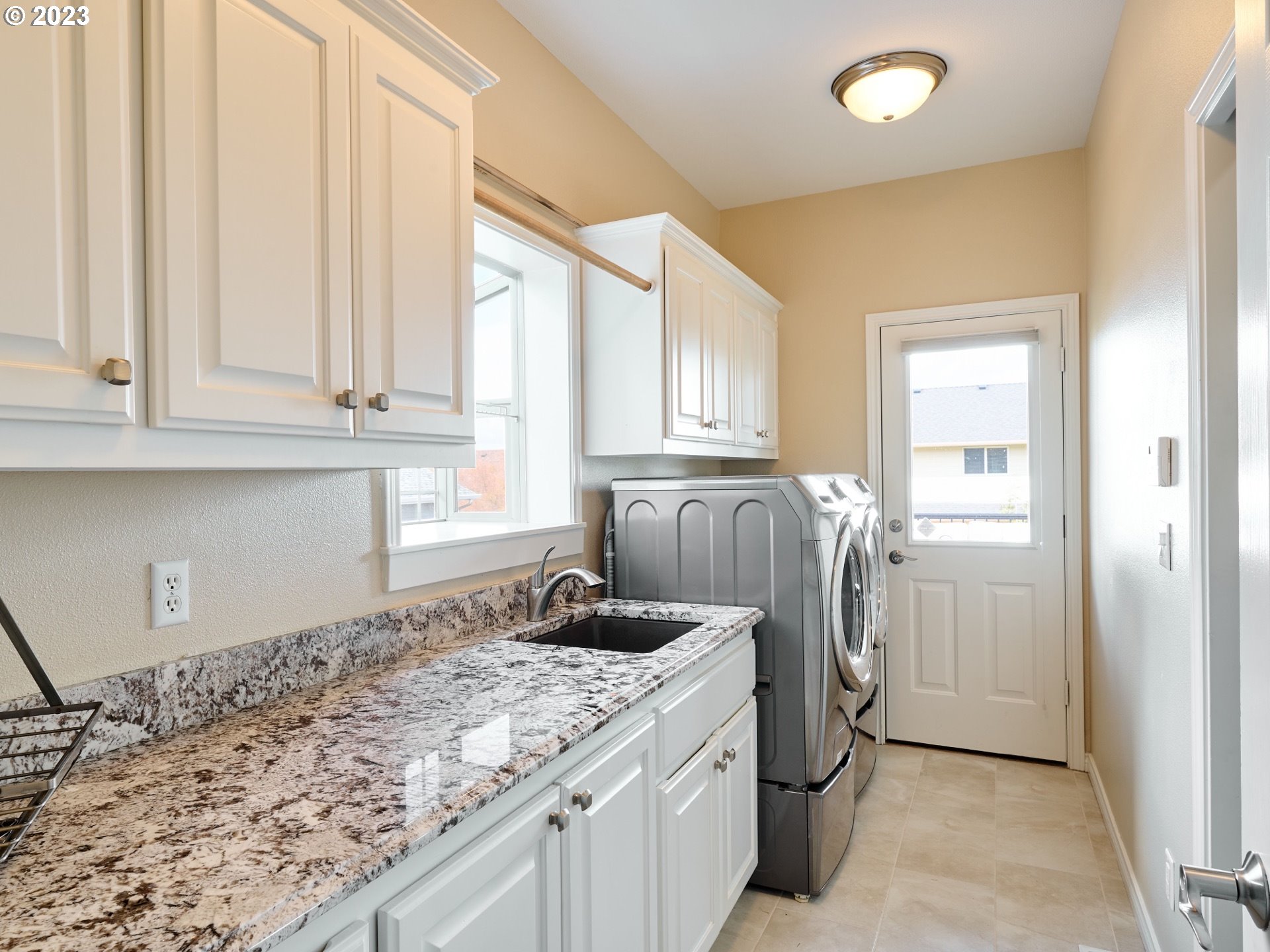 104 Breyonna Way Silverton, OR 97381 - Photo 31 of 45 a kitchen with a sink and cabinets