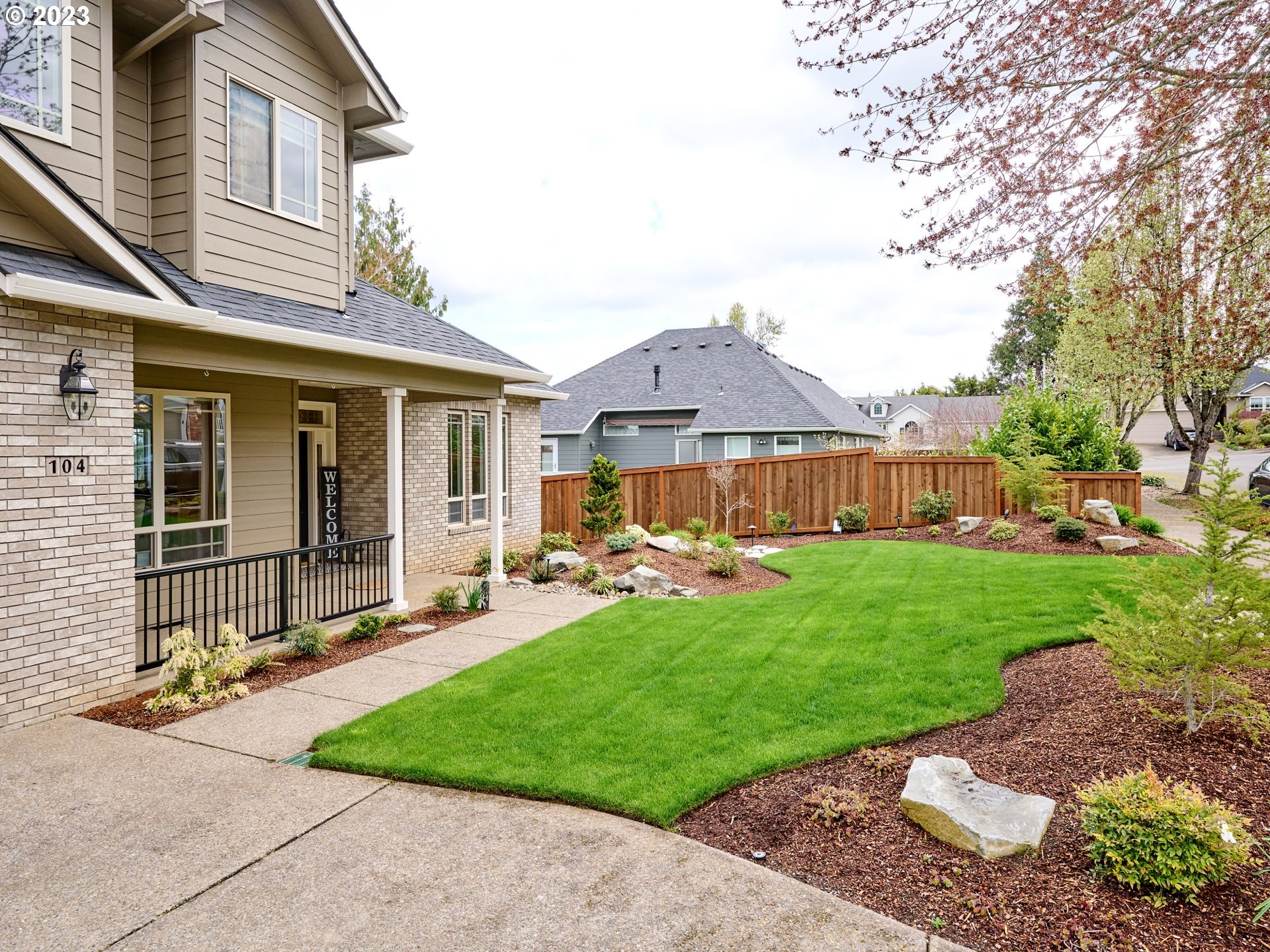 104 Breyonna Way Silverton, OR 97381 - Photo 34 of 45 a front view of a house with garden