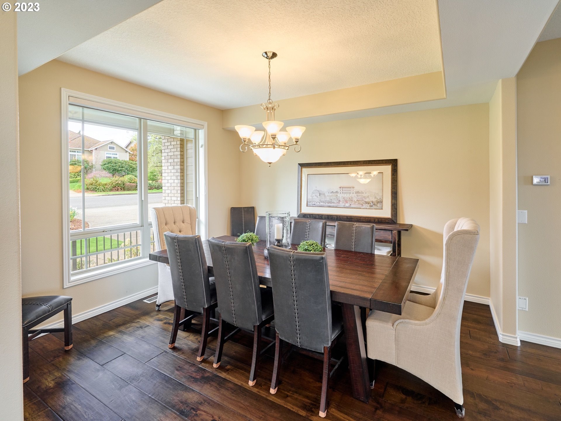 104 Breyonna Way Silverton, OR 97381 - Photo 4 of 45 a view of a dining room with furniture a chandelier and wooden floor