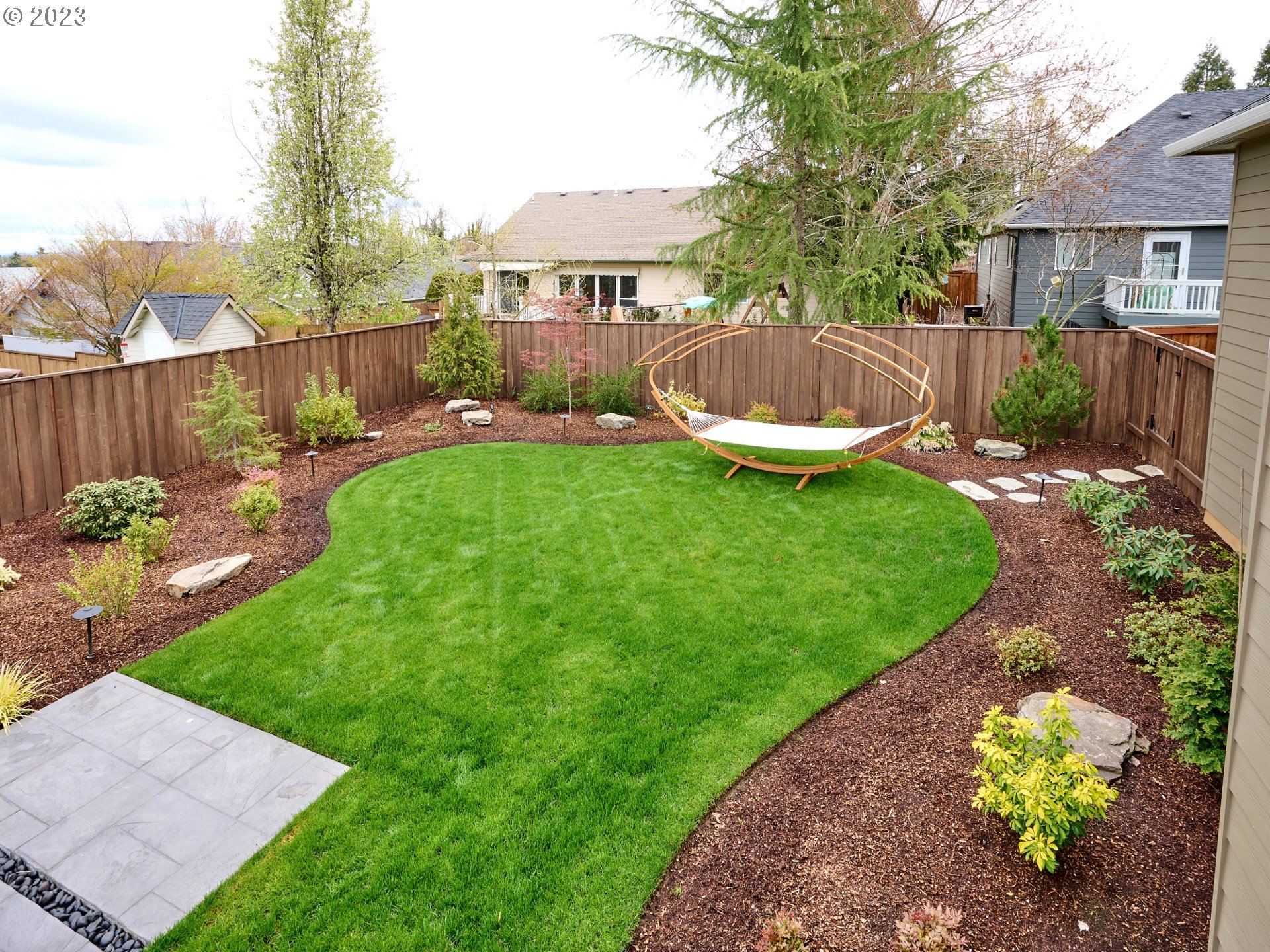 104 Breyonna Way Silverton, OR 97381 - Photo 41 of 45 a view of a backyard with a garden and plants