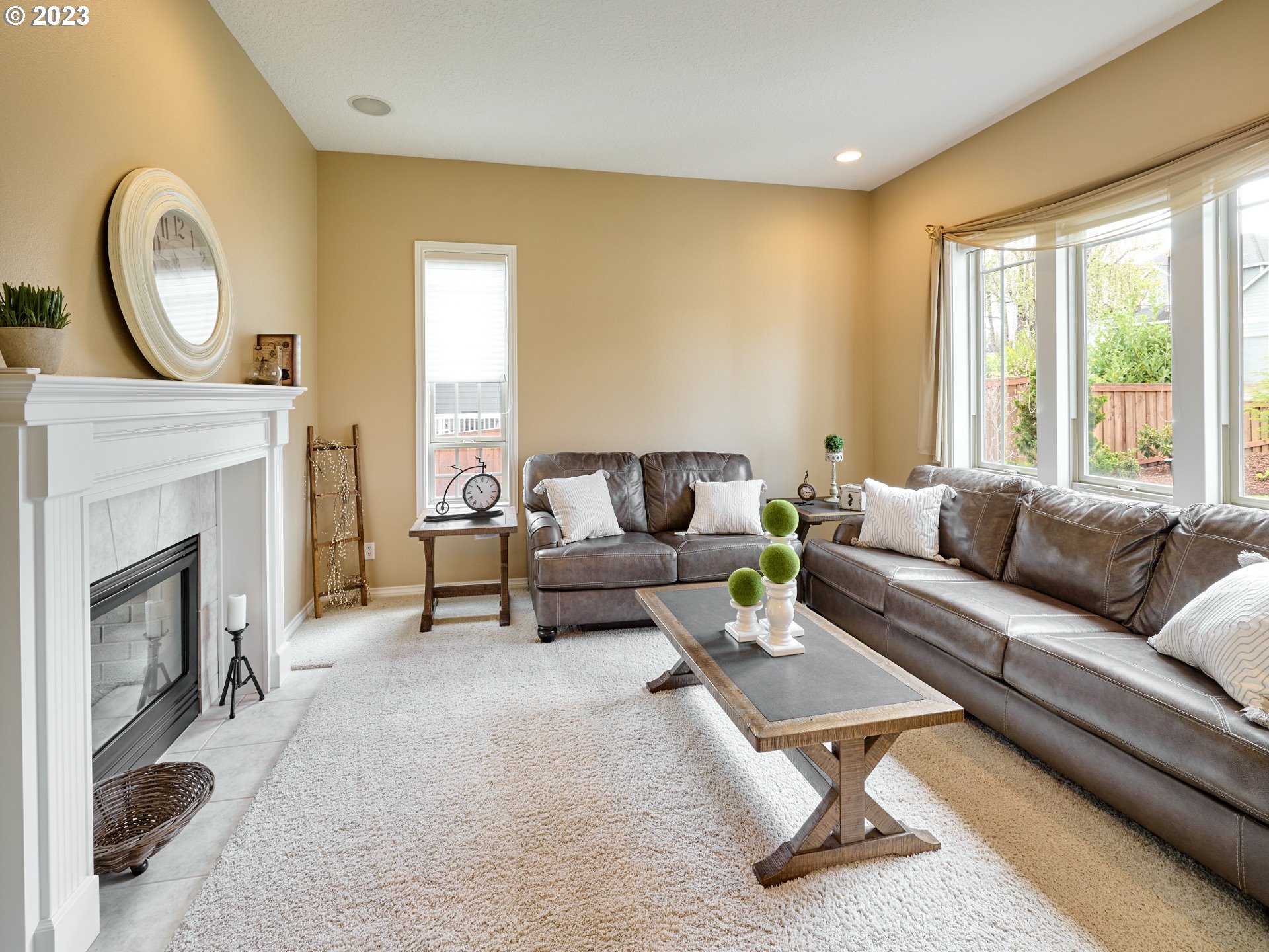 104 Breyonna Way Silverton, OR 97381 - Photo 6 of 45 a living room with furniture a fireplace and a large window