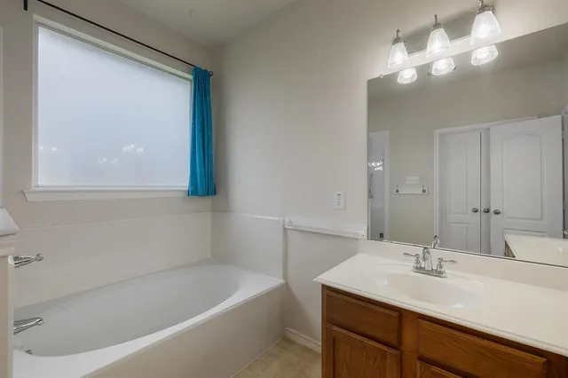 a bathroom with a sink and a bathtub