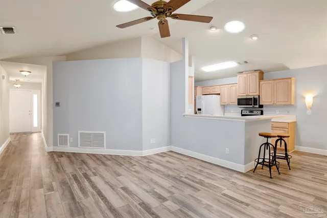 a view of a kitchen from the hallway
