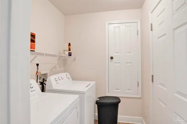 a balcony with wooden floor and fence