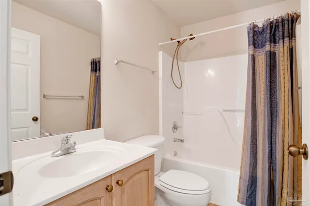 a bathroom with a sink toilet tub and shower