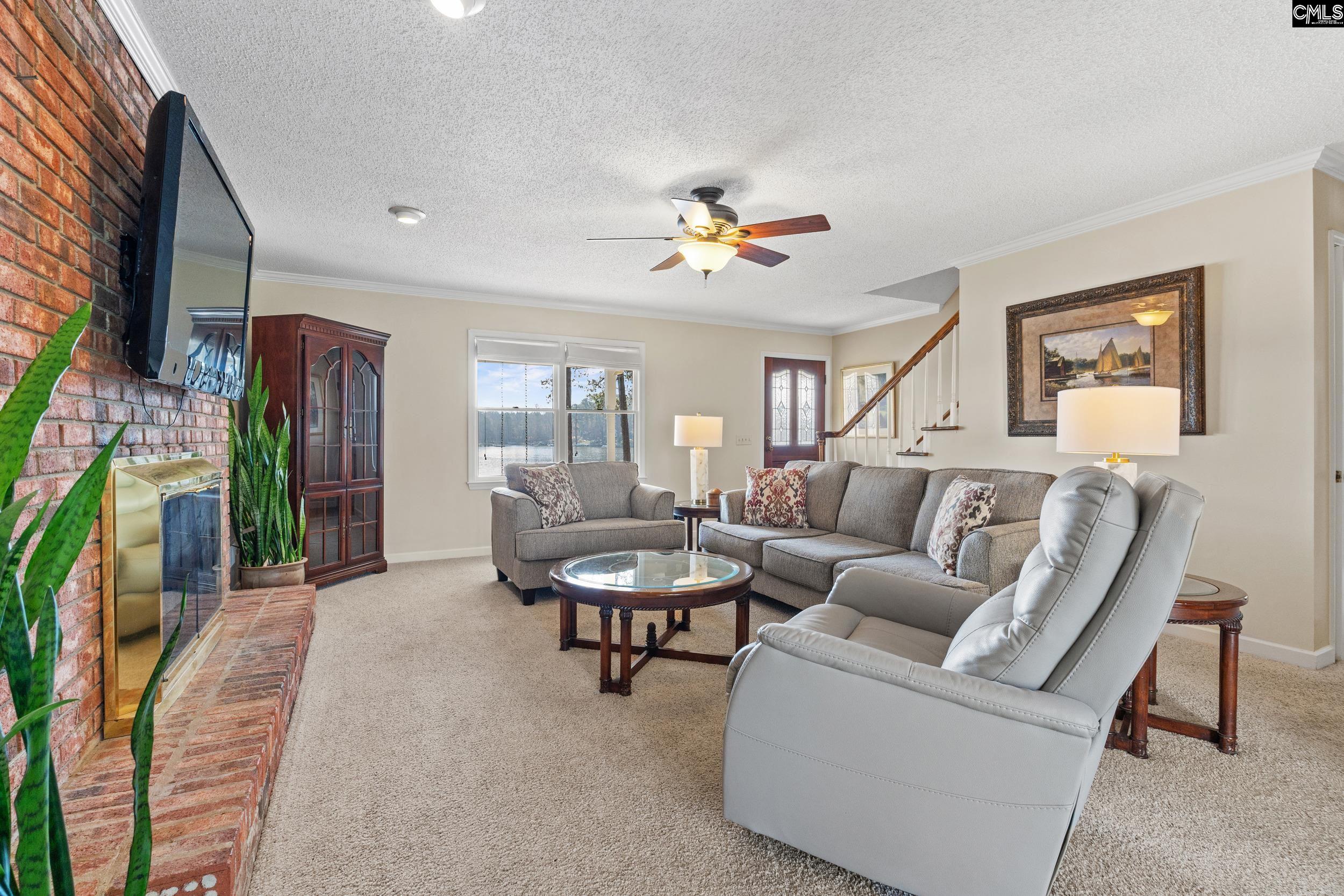 115 Rocky Ridge Road Leesville, SC 29070 - Photo 9 of 51 a living room with furniture and a flat screen tv