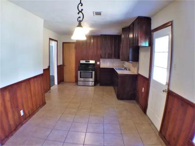 a large kitchen with a large counter top space