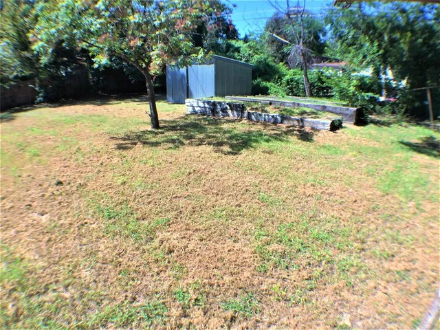 a view of a house with a tree