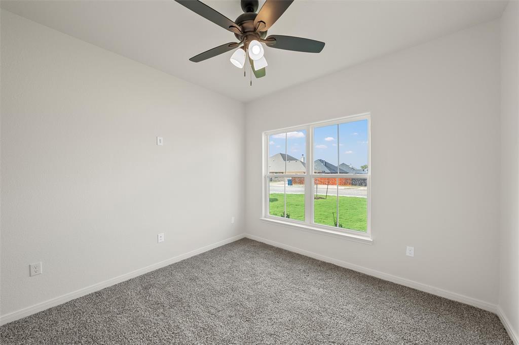 920 Gallant Fox Hewitt, TX 76643 - Photo 24 of 36 an empty room with a window and a fan