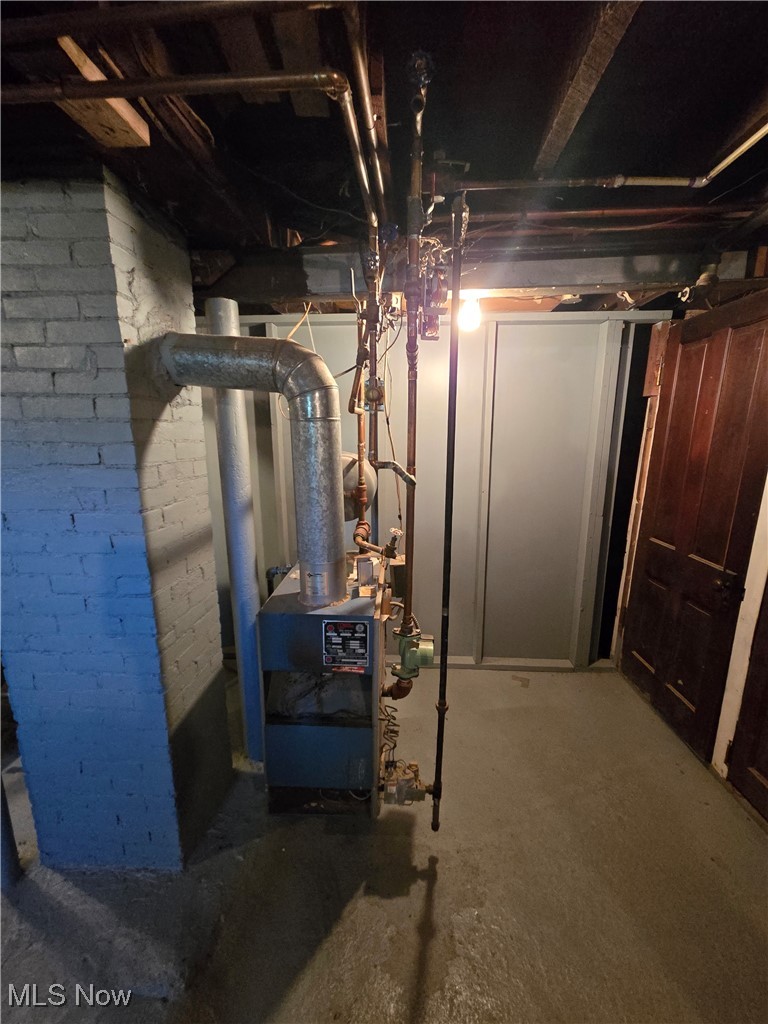 5555 Detroit Road Sheffield, OH 44054 - Photo 24 of 50 Unfinished below grade area featuring a heating unit