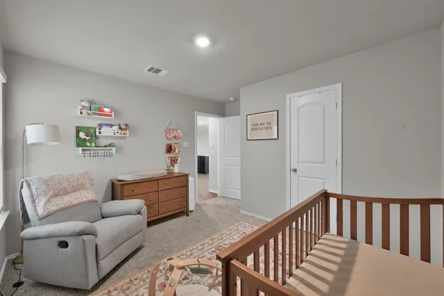 a view of a backyard with sitting area