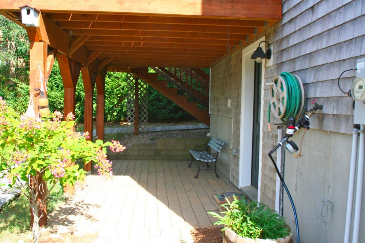 6 Shore Road, Unit 7 Truro, MA 02666 - Photo 10 of 12 a view of a patio with table and chairs and potted plants